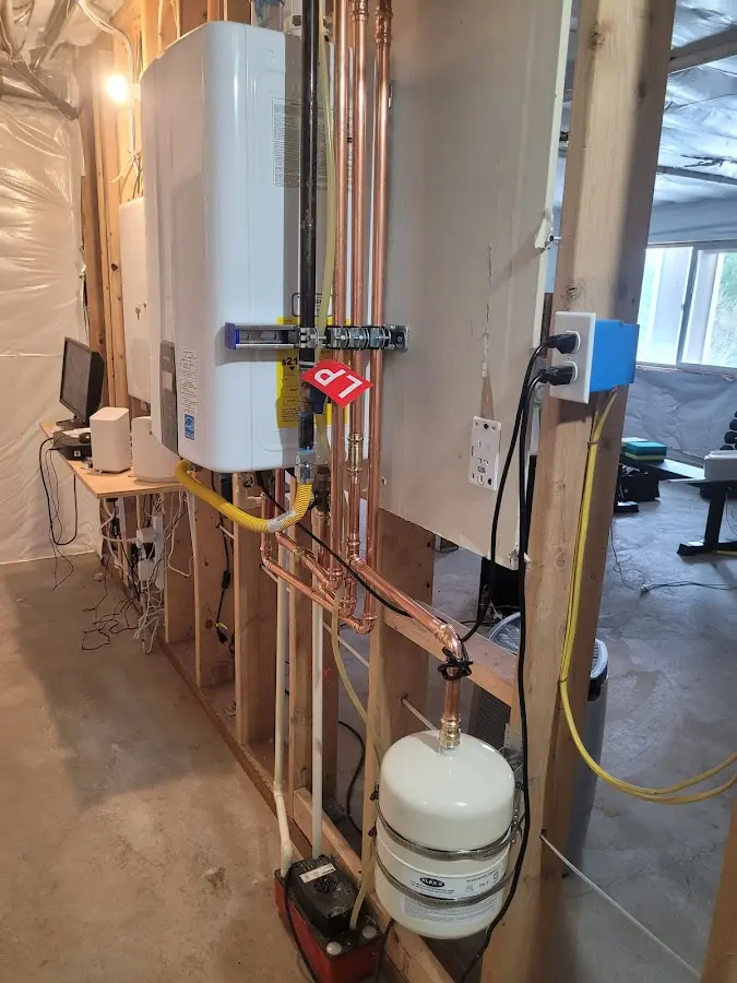 Licensed plumber repairing a kitchen sink in Pleasant Hills